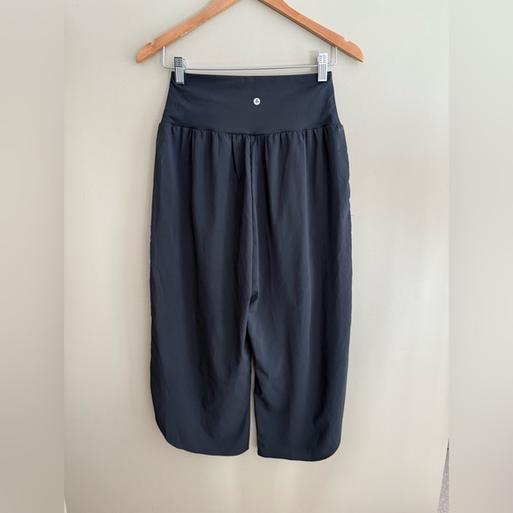 HALARA Black Cropped Pants with an Asymmetrical Bottom and Crisscross Front - Picture 13 of 17